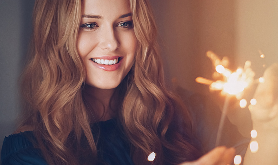 woman holding a sparkler