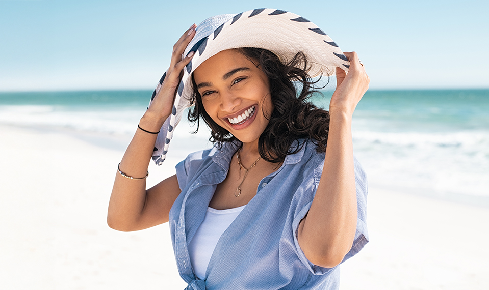woman at the beach smiling
