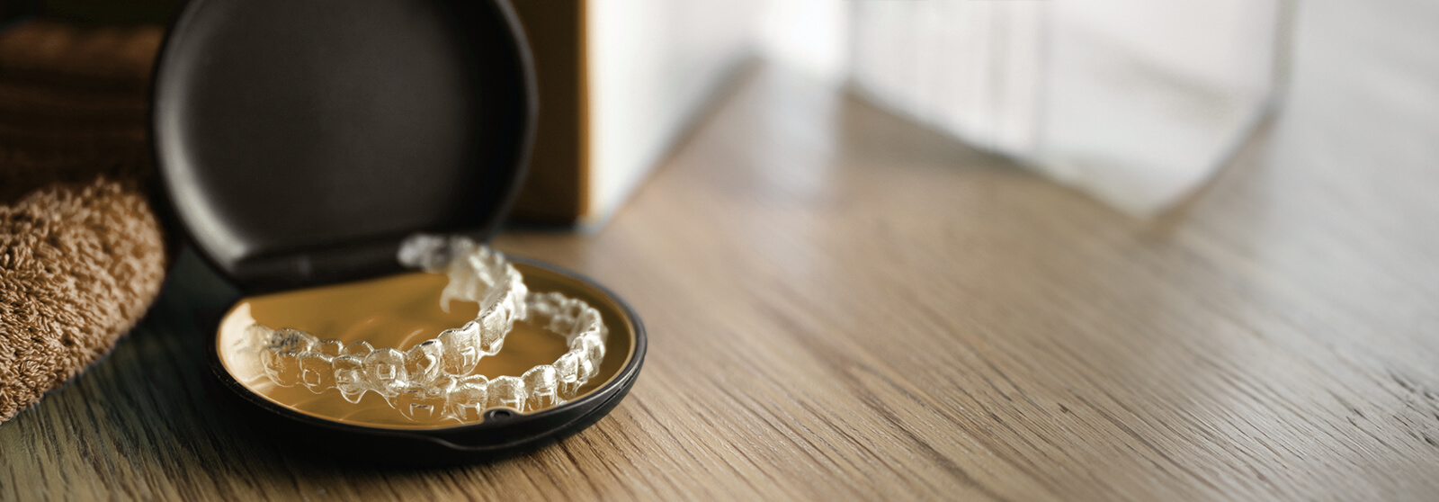 SureSmile clear aligners sitting in case