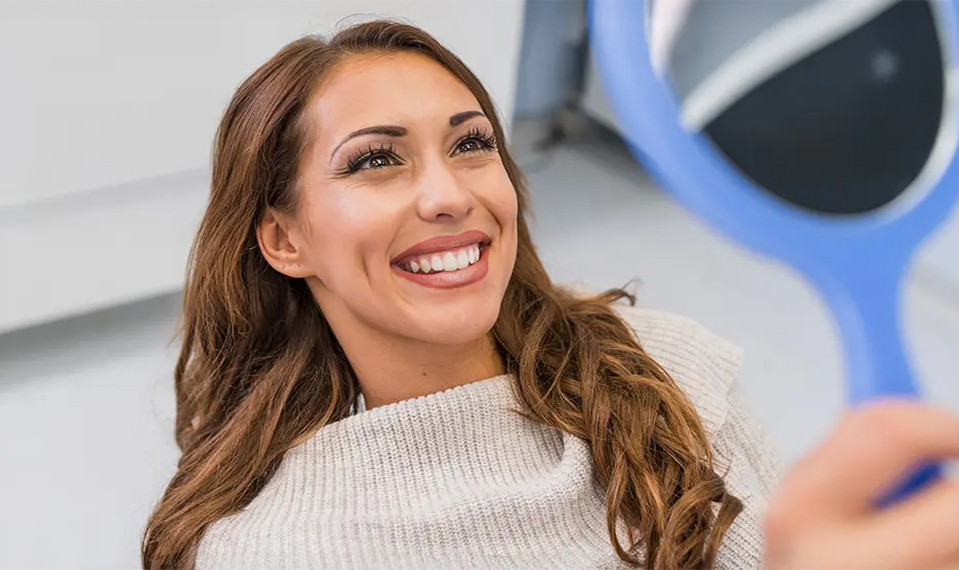 woman smiling in mirror