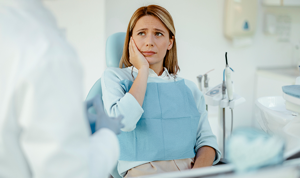 woman experiencing dental pain