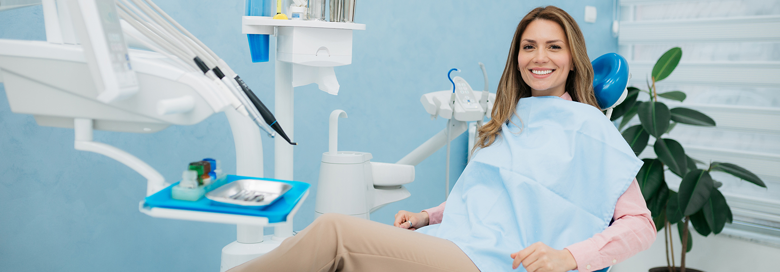 smiling woman at dentist's office